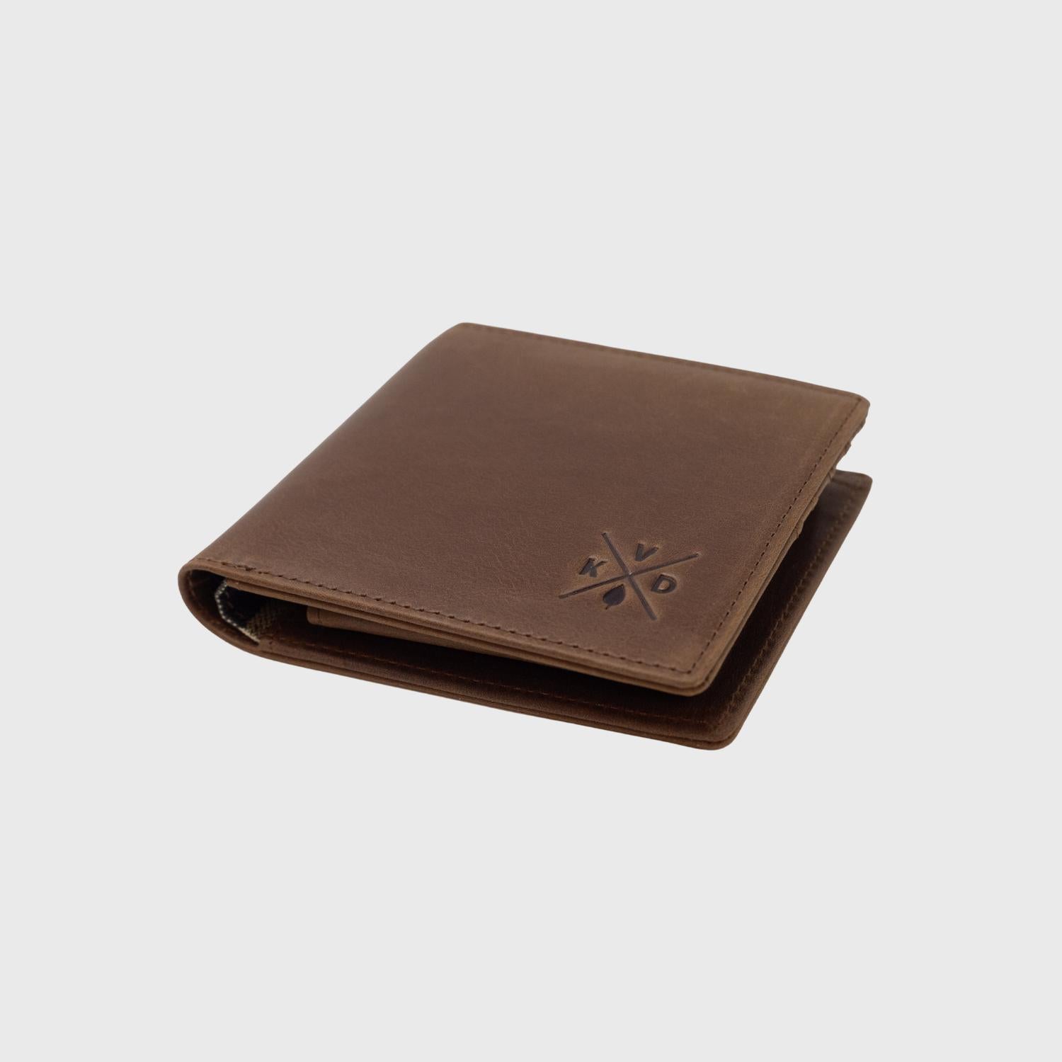 Closed image of the Ashford - Tan Bifold Leather Wallet laid on its back.