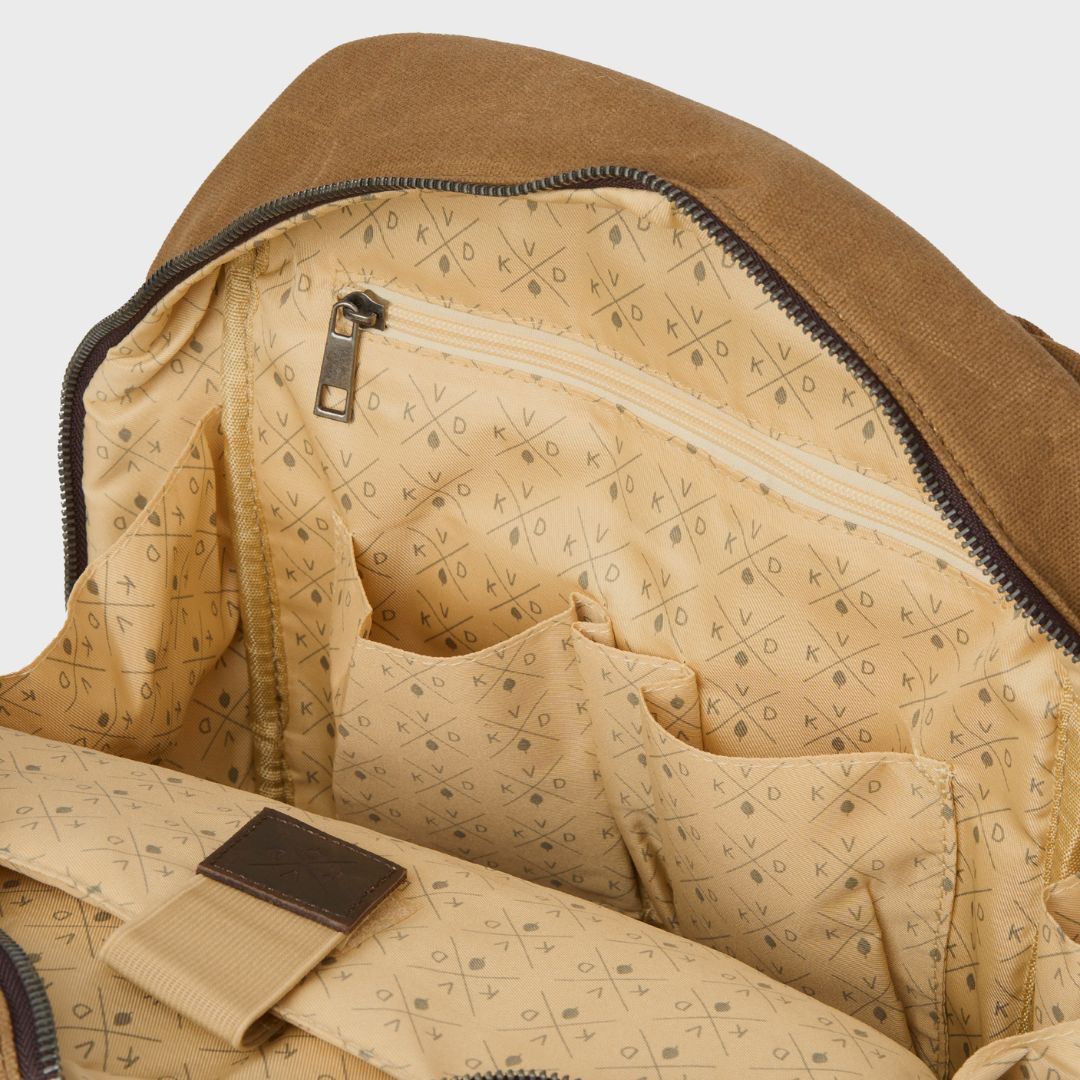 Interior lining of Eden backpack with printed Kovered logo and zipped internal pockets