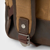Eden waxed canvas backpack straps with Kovered logo on rivets