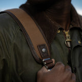 Close up of padded backpack straps with Kovered branded rivet