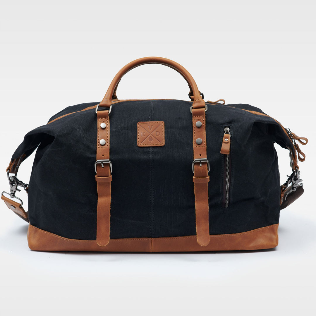 Kovered Humber black and tan duffle holdall bag made from waxed canvas and reclaimed leather front view#colour_black