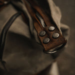 Kovered waxed canvas and reclaimed leather moss green duffel bag close up of detail#colour_moss-green