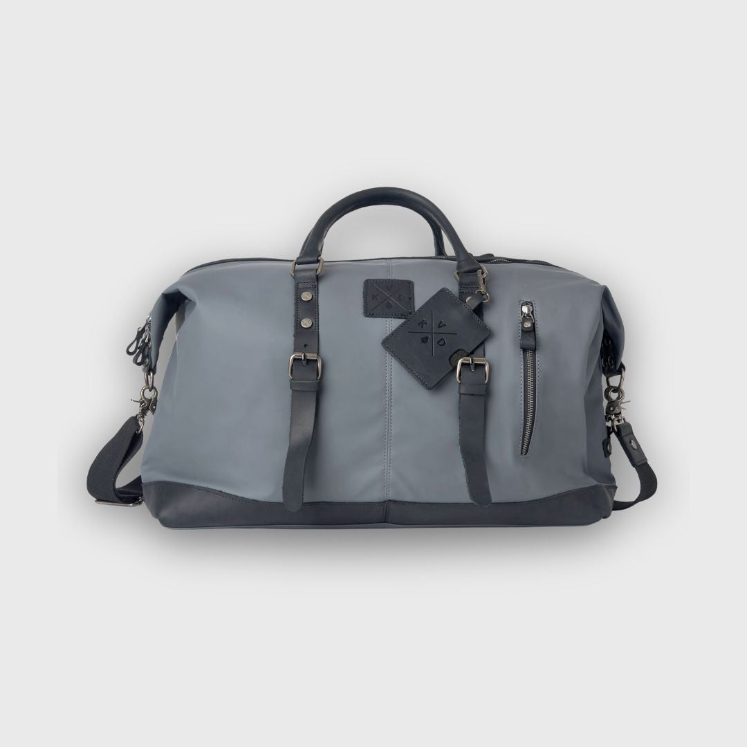 Gray duffel bag with black accents on a light gray background
