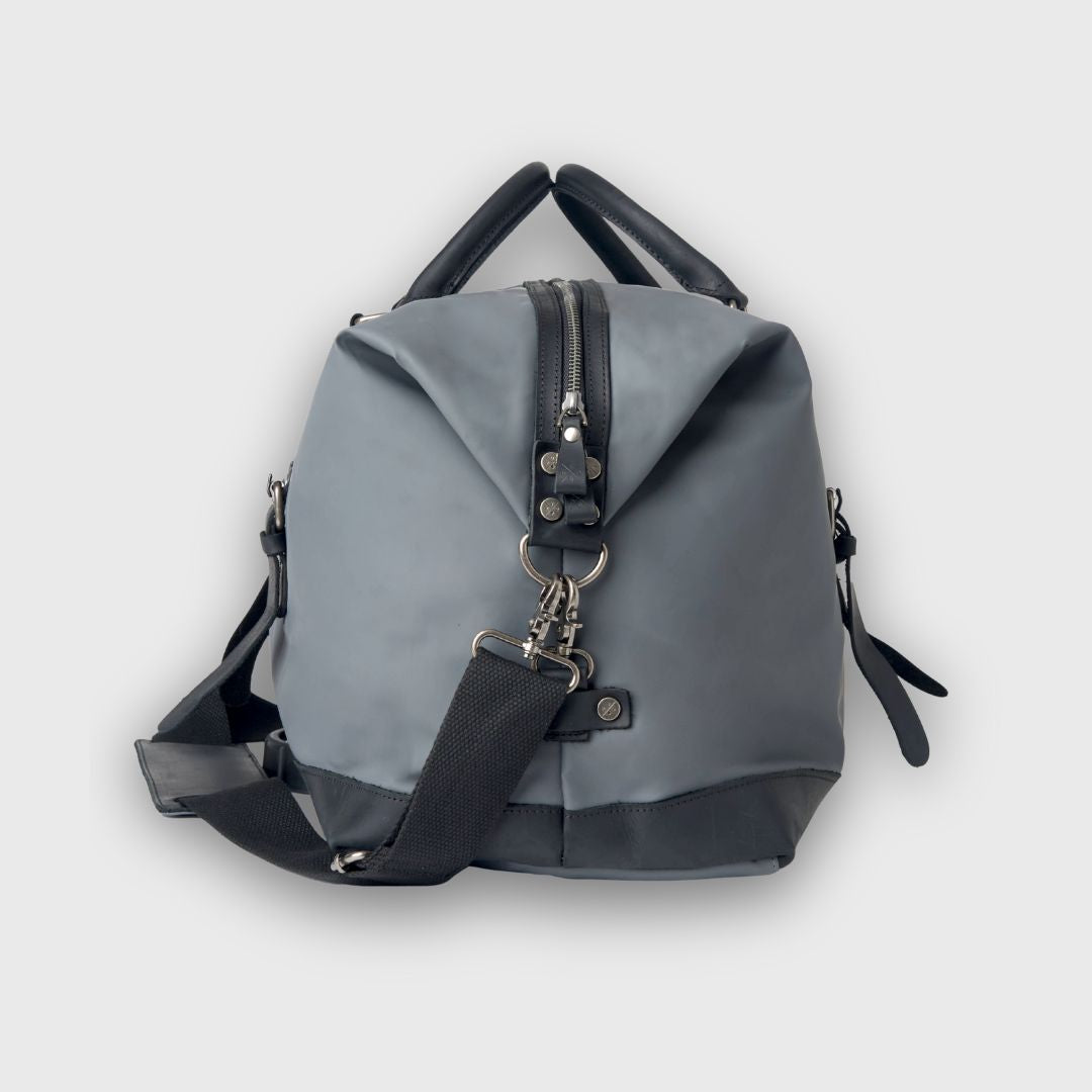 Gray backpack with black accents on a light gray background