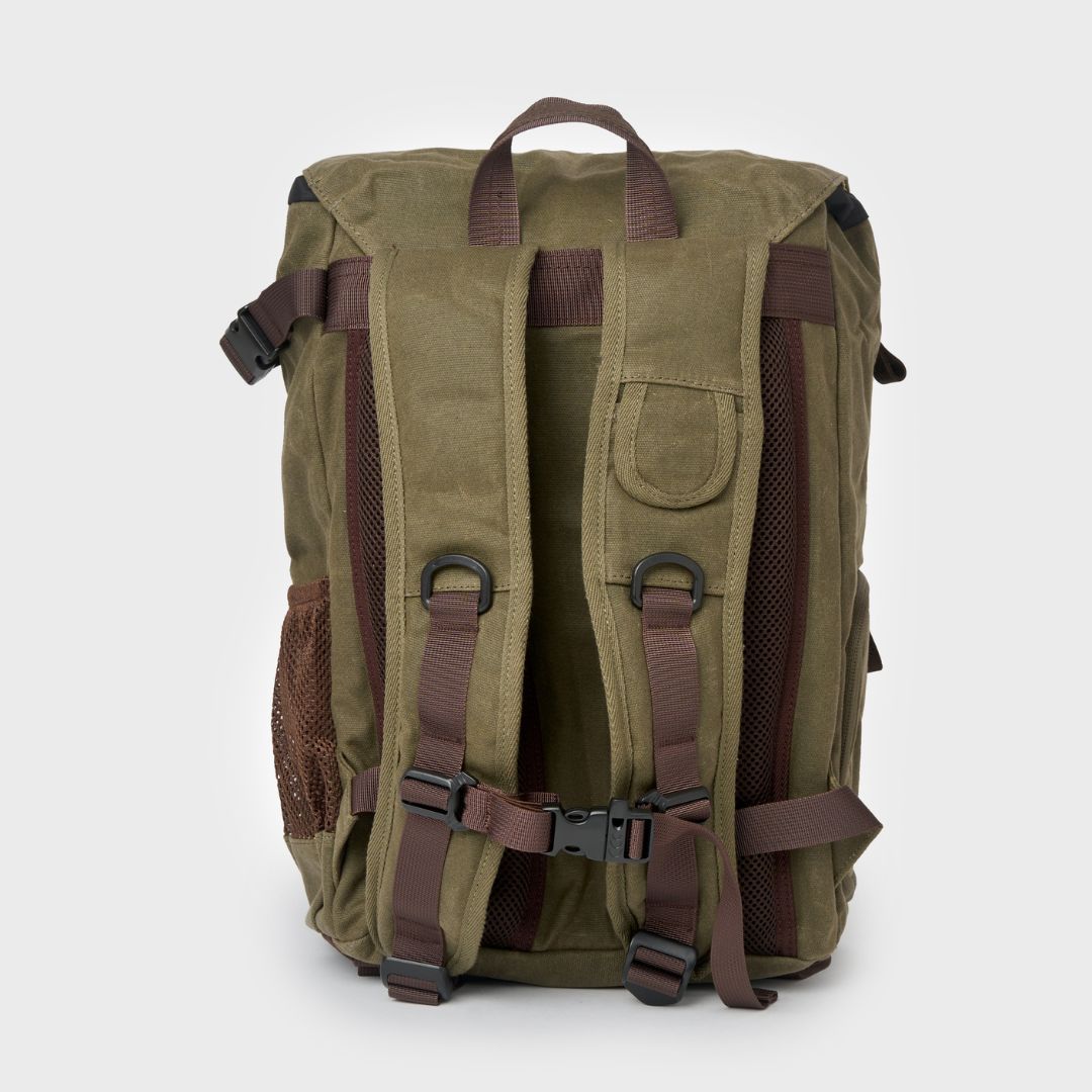 Padded backpack straps and adjustable sternum strap on the reverse of the waxed canvas Roe backpack