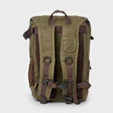 Padded backpack straps and adjustable sternum strap on the reverse of the waxed canvas Roe backpack