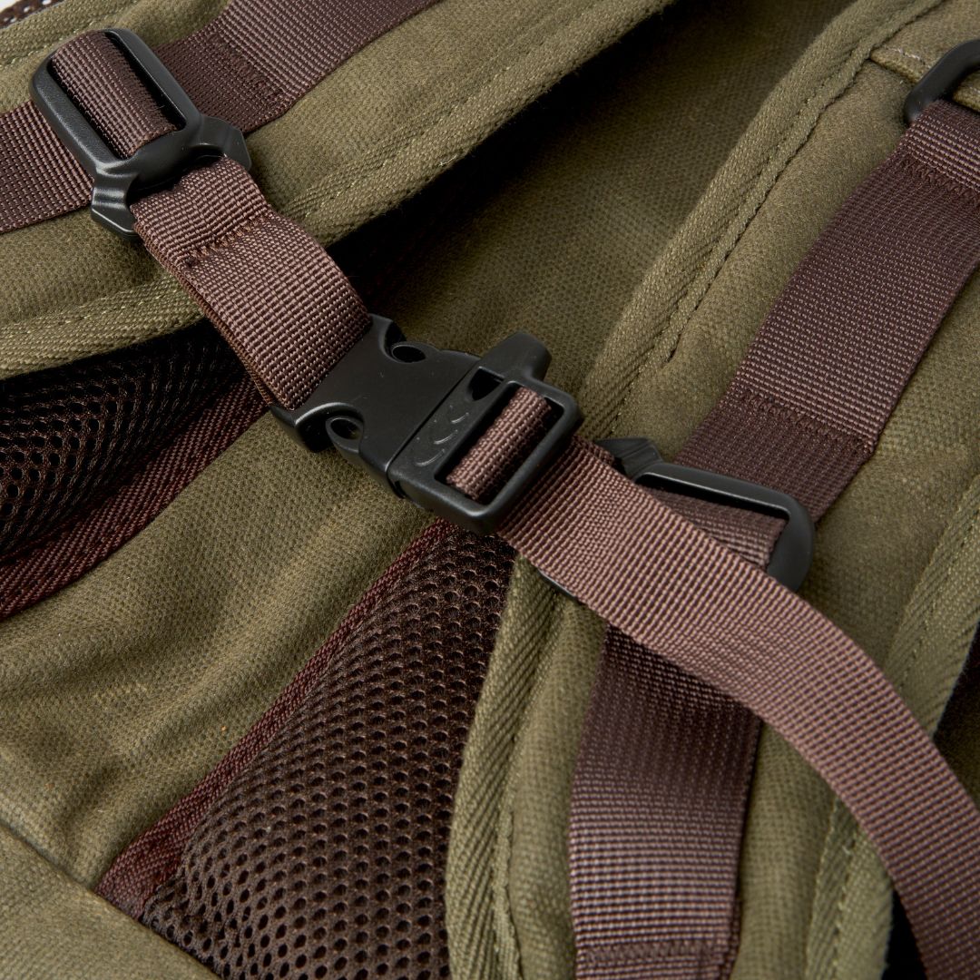 Adjustable sternum strap on the reverse of the Roe waxed canvas camera/adventure backpack