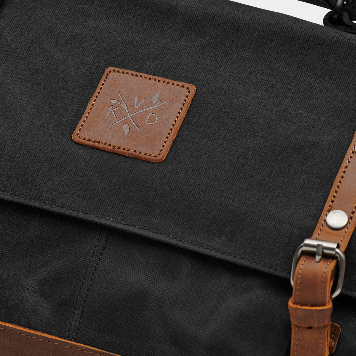 The Black Mersey Messenger Satchel Bag in waxed canvas with reclaimed leather