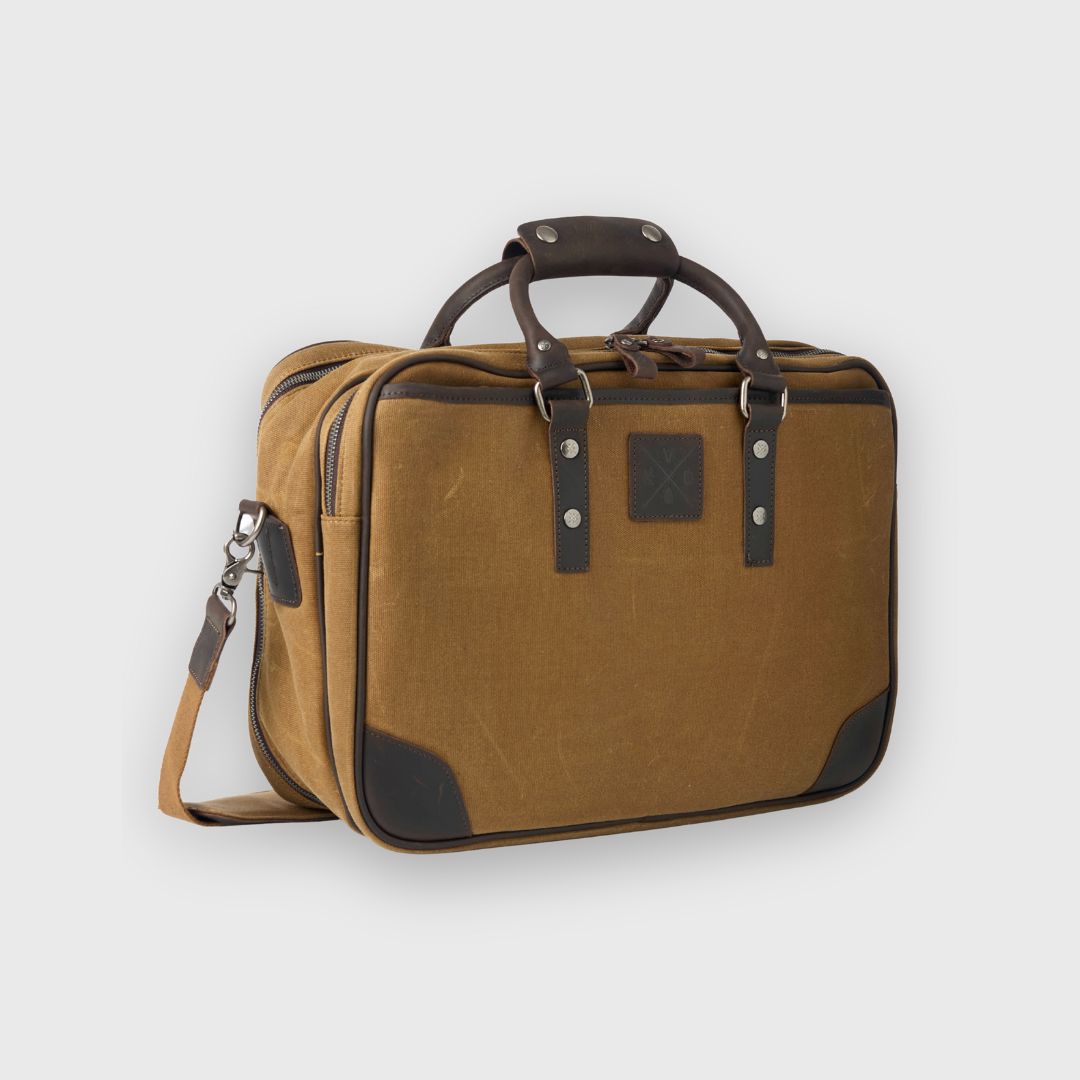 Brown travel bag with black accents on a light gray background