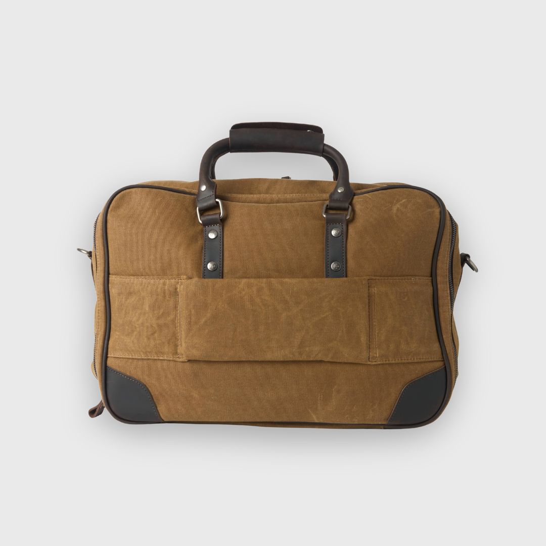 Brown leather suitcase with black accents on a white background