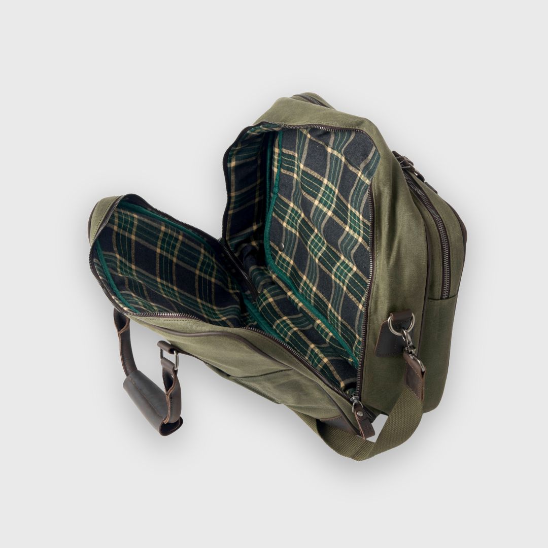 Green bag with plaid interior on a white background