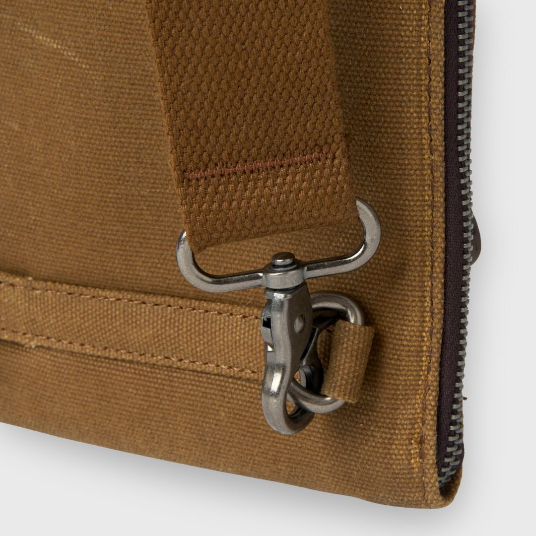 Close-up of a brown bag with a metal clasp on a white background