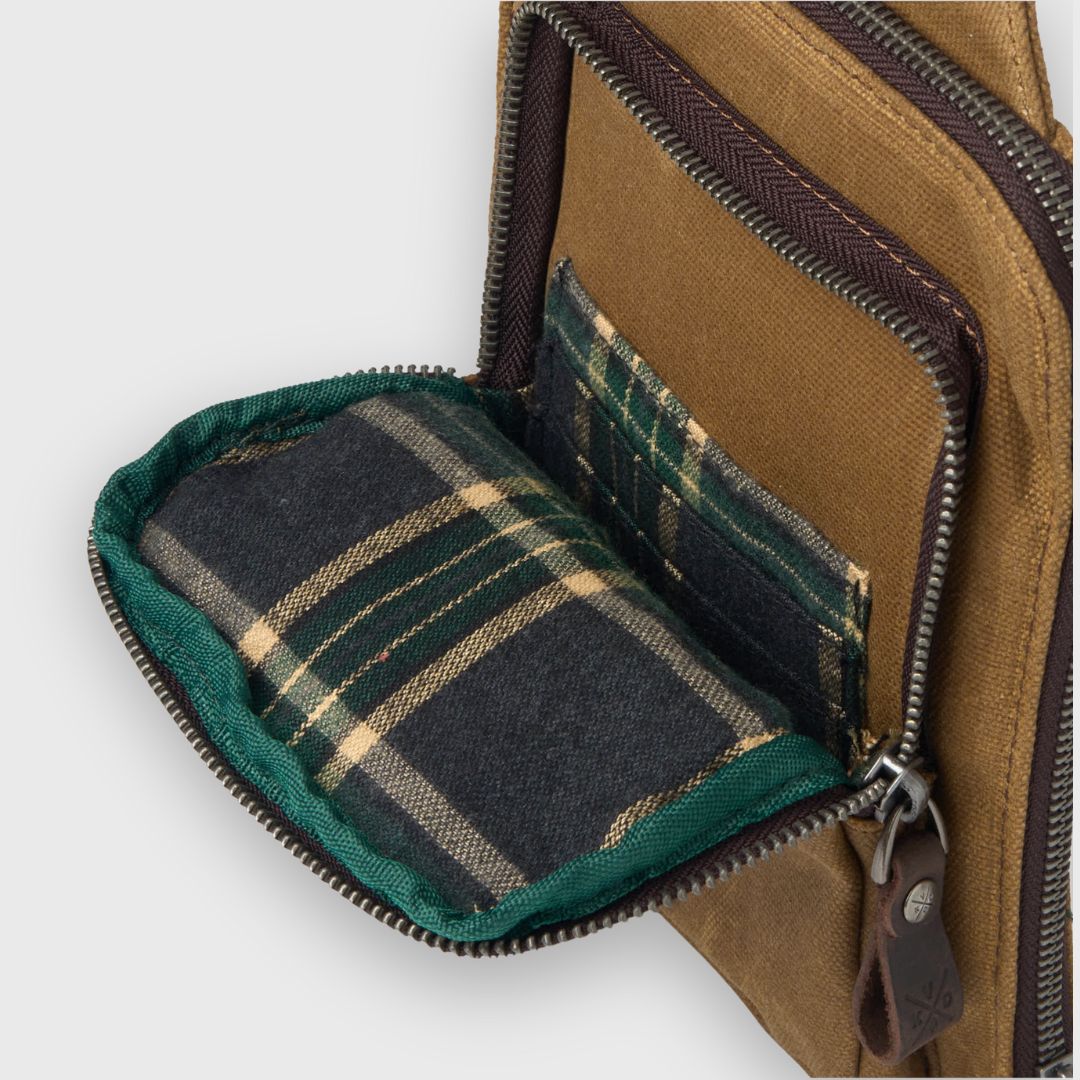 Brown bag with plaid lining on a white background