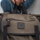Close up image of canvas and leather on the Lune - Moss Green Backpack