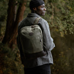 Man wearing Eden waxed canvas and reclaimed leather over one shoulder