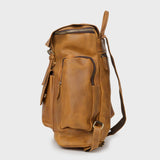Side view of reclaimed leather Esk - Tan backpack with side zipped pocket 