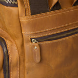 Close up of leather zip pull on Esk reclaimed leather backpack 