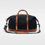 Kovered black and tan holdall bag back view with strap made from waxed canvas and reclaimed leather#colour_black
