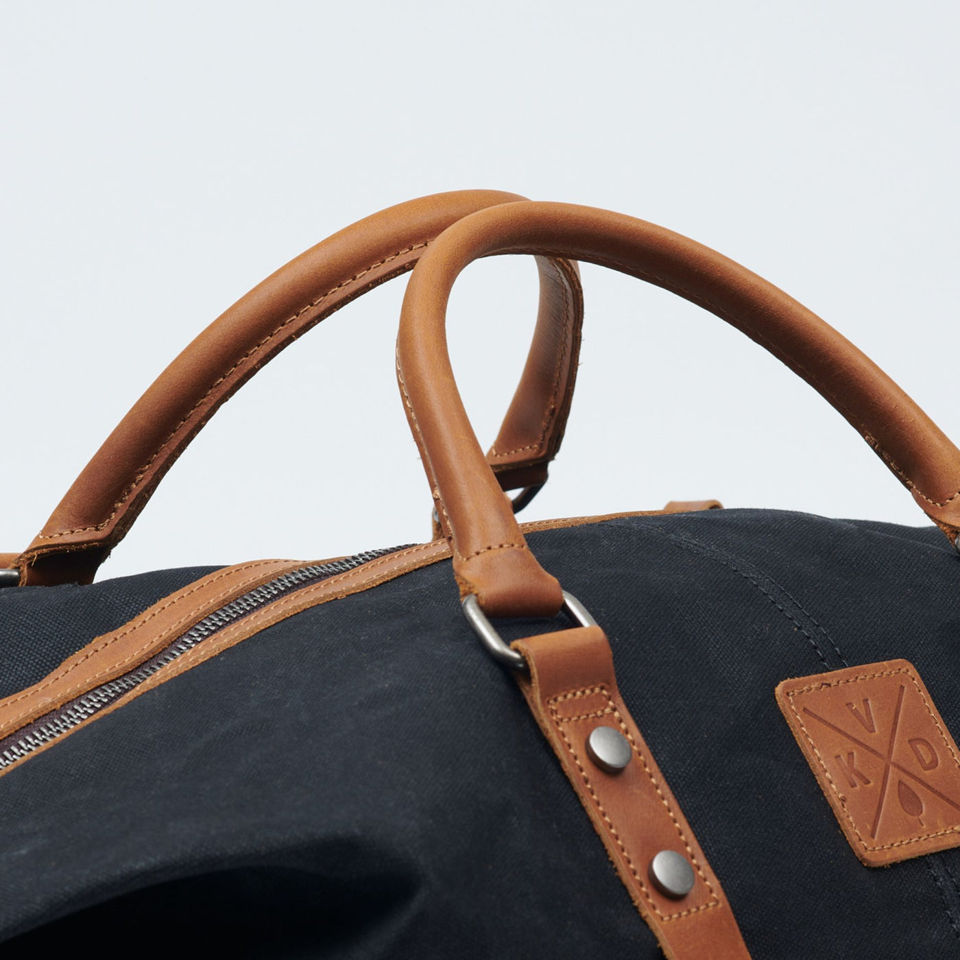 Kovered black and tan Humber holdall grab handles made from reclaimed leather#colour_black