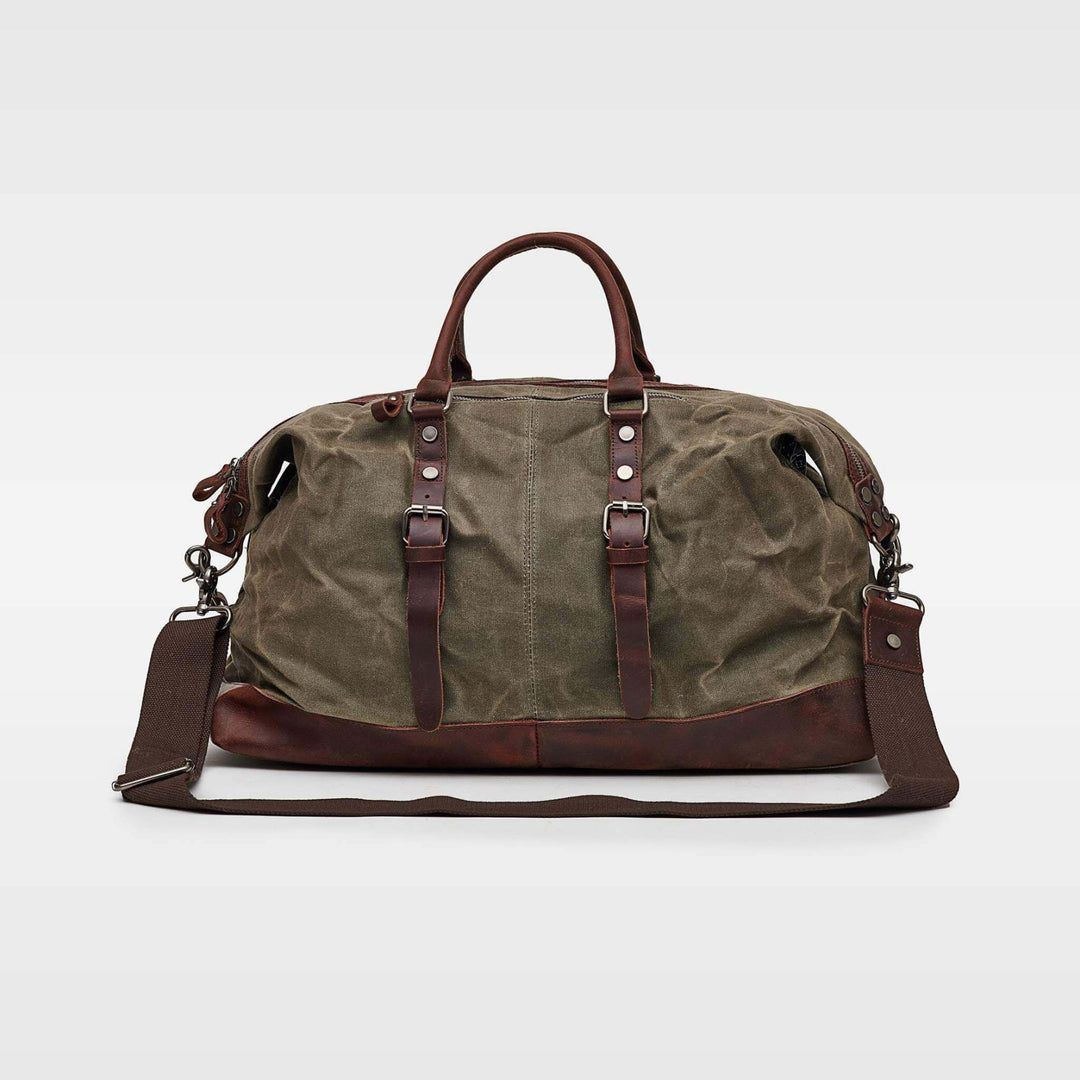 Kovered Humber holdall duffle bag in moss green made from reclaimed leather and waxed canvas#colour_moss-green