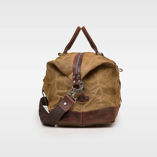 Kovered tan Humber duffel bag made from waxed canvas and reclaimed leather side view#colour_tan