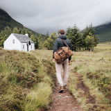 Kovered Tan Humber holdall being carried by a man walking through a field in Scotland#colour_tan