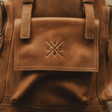Close up of Kovered logo on reclaimed leather backpack