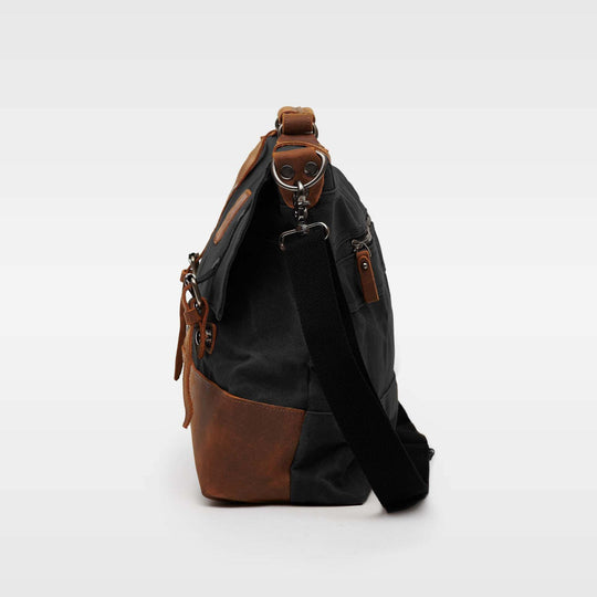 Kovered black and tan Mersey messenger satchel bag side view#colour_black