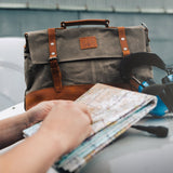 Kovered moss green Mersey satchel laptop bag with map and headphones#colour_moss-green
