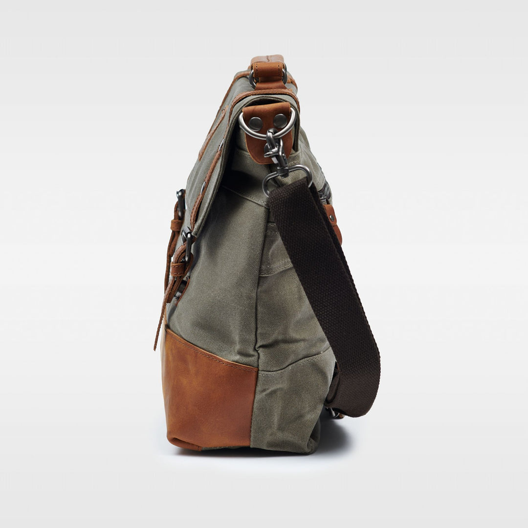 Kovered Mersey messenger bag made from reclaimed leather and waxed canvas side view#colour_moss-green