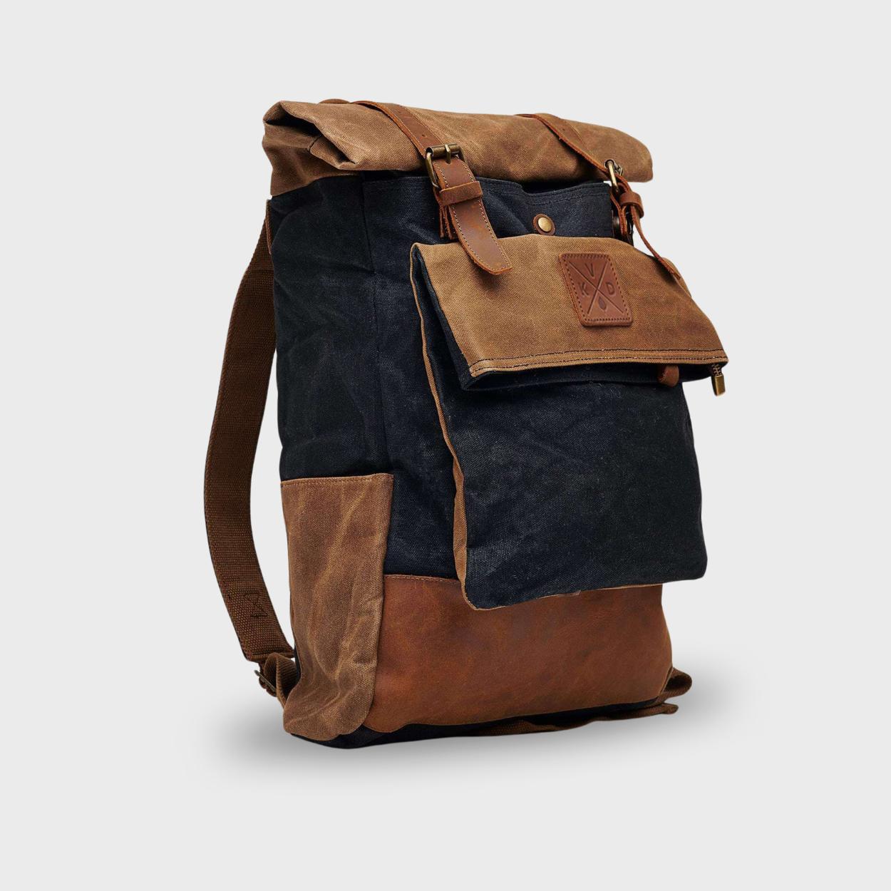 Kovered black and tan rolltop backpack waxed canvas and reclaimed leather angled view#colour_black