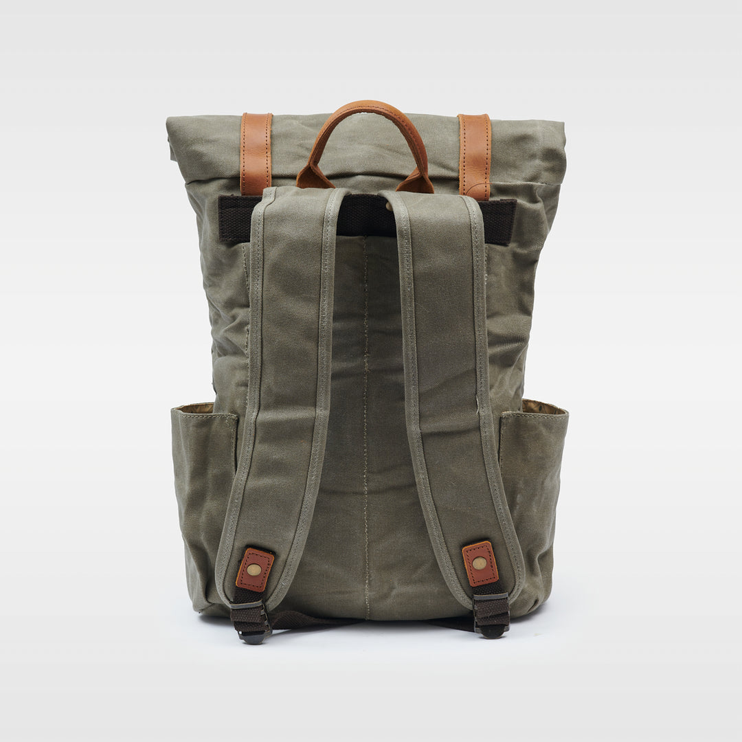 Green waxed canvas rolltop backpack back view#colour_moss-green