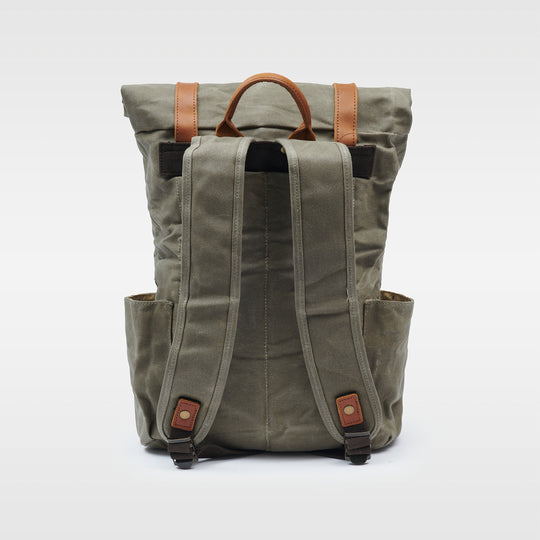 Green waxed canvas rolltop backpack back view#colour_moss-green