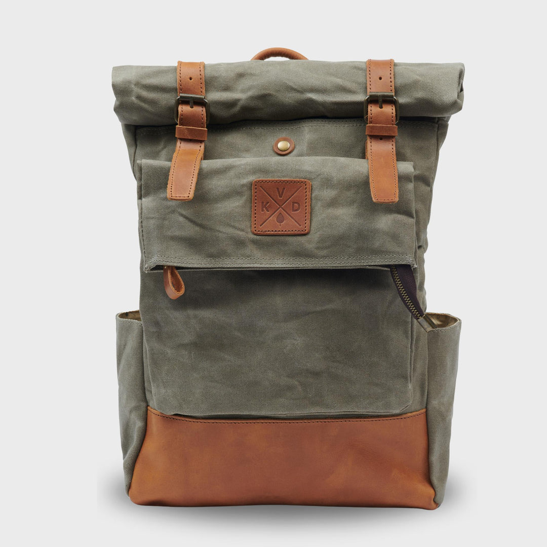 Green rolltop waxed canvas backpack with magnetic buckles#colour_moss-green
