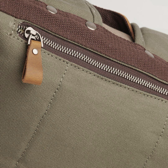 Tay canvas and reclaimed leather backpack close up of anti theft pocket#colour_taupe