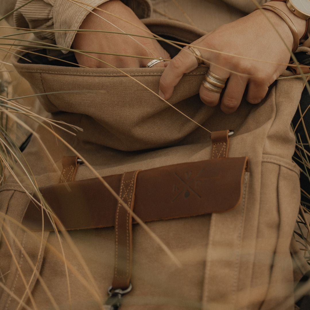 Kovered Tay sustainable reclaimed leather backpack close up with model#colour_tan