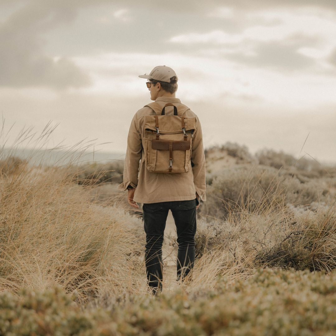 Kovered Tay canvas and reclaimed leather backpack on model in Australia#colour_tan