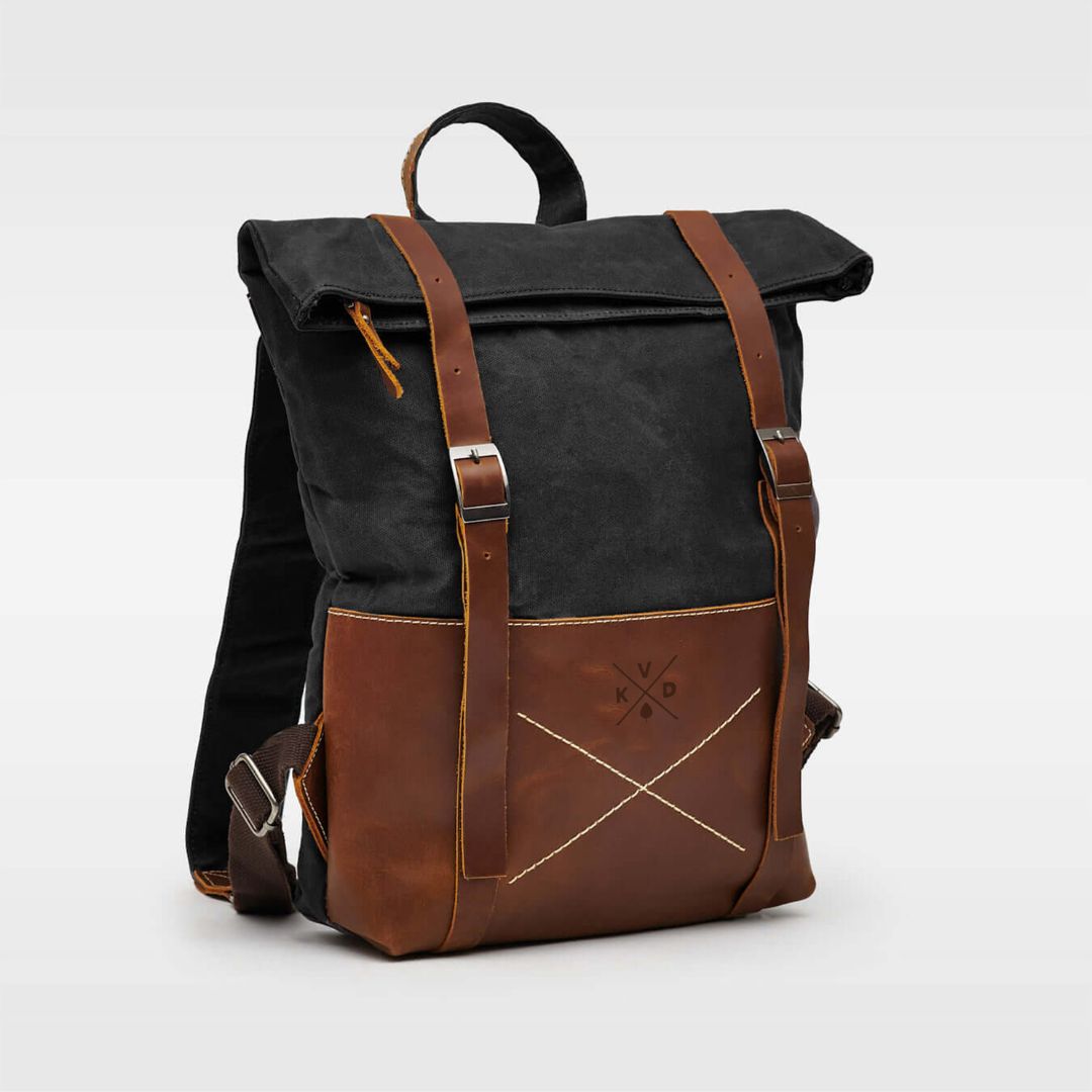 Kovered Thames waxed canvas and reclaimed leather backpack black angled view#colour_black