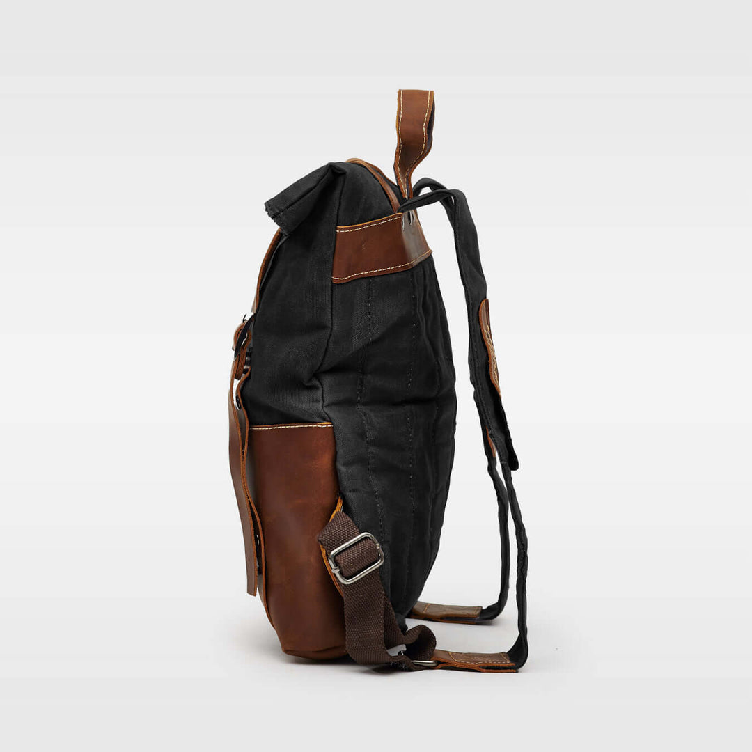 Kovered Thames waxed canvas and reclaimed leather backpack side view#colour_black