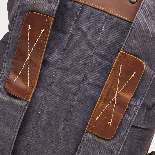 Kovered Thames grey waxed canvas and brown reclaimed leather backpack strap detail#colour_grey