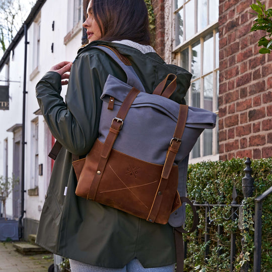 Witham blue canvas and reclaimed leather backpack on female model#colour_blue