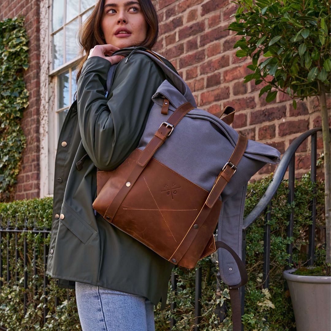 Witham blue canvas and leather backpack on female model#colour_blue