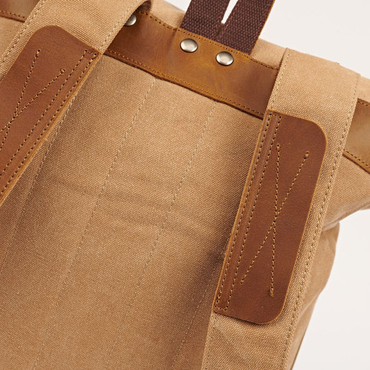 Witham tan canvas and reclaimed leather backpack close up of backpack strap detail#colour_tan