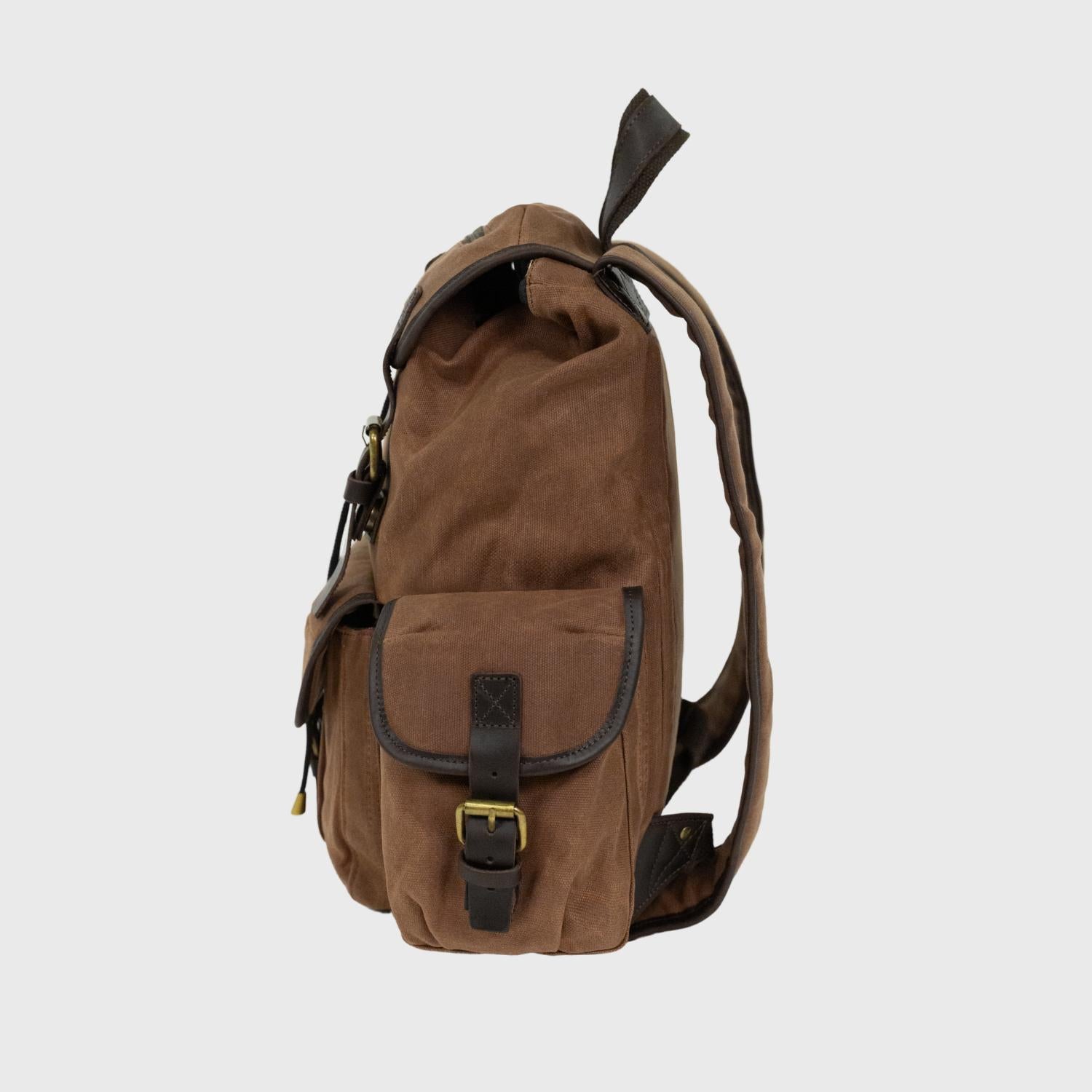 Side pocket showing the magnetic buckle on the Lune Backpack.