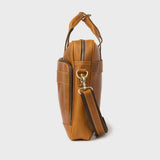 Side view of the leather Manifold satchel with front zipped pocket and trolley sleeve