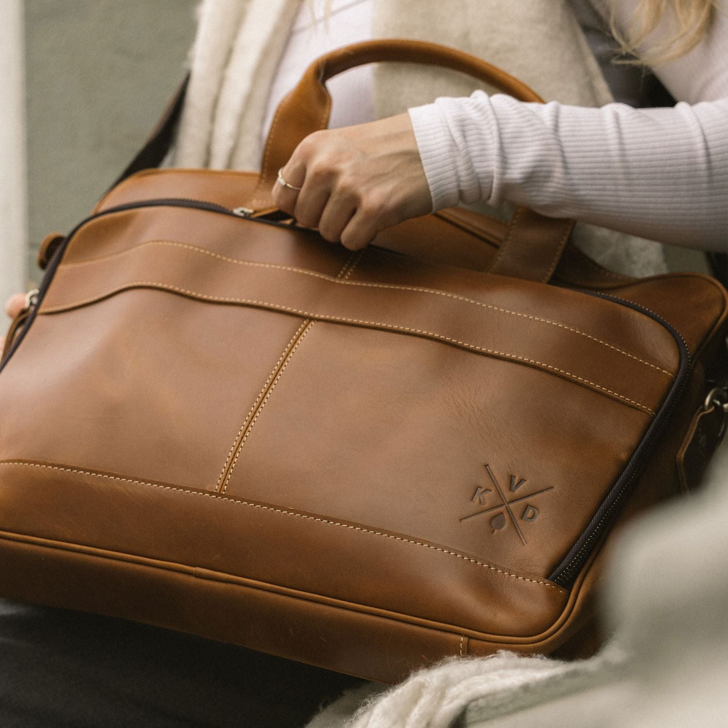Front view of the brown leather Manifold messenger bag 