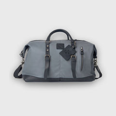 Gray duffel bag with black accents on a light gray background