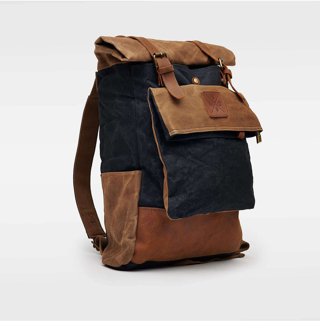 Kovered black and tan rolltop backpack waxed canvas and reclaimed leather angled view#colour_black