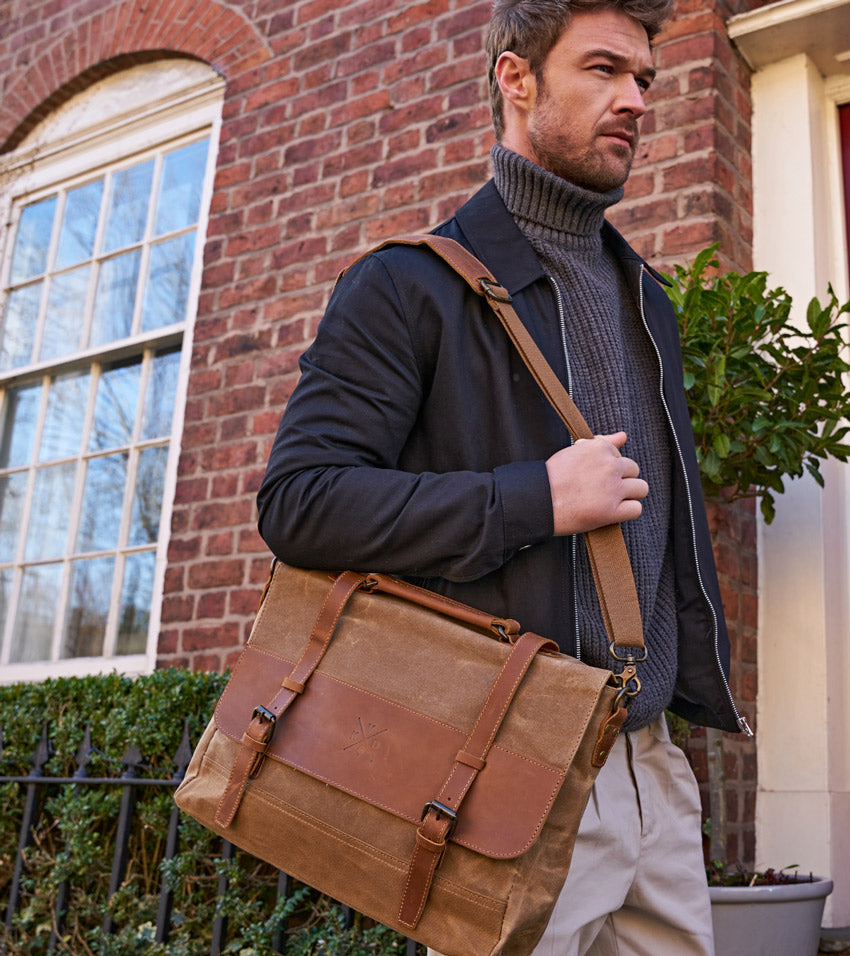 a man walking down the street with our medway waxed canvas messenger satchel bag
