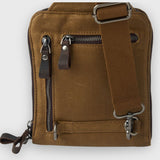 Brown leather bag with zippers and a strap on a white background